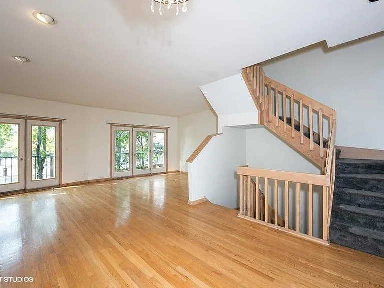 Dining room & living room with hardwood floors and fireplace
