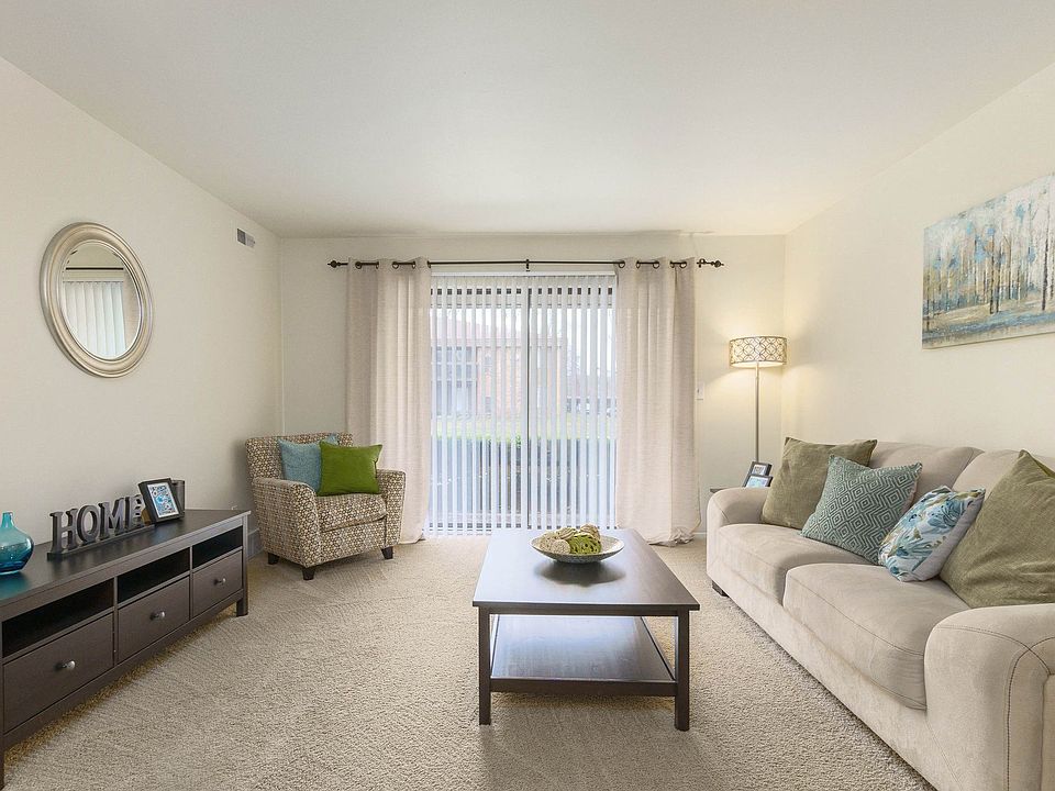Bright and airy living room with natural light at Eastwood Village Apartments in Clinton Township, MI
