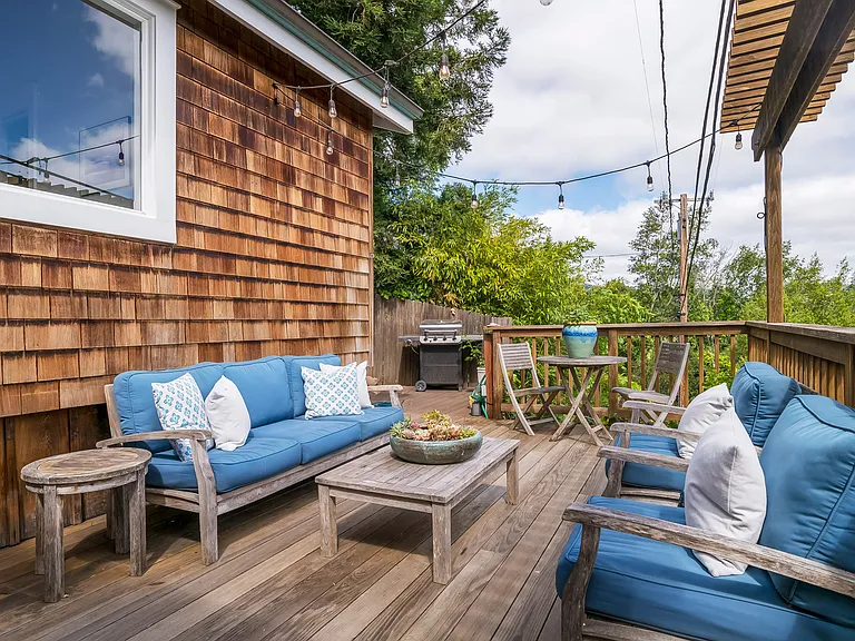 Front deck with view of the BBQ. Private outdoor shower out of view around the corner.