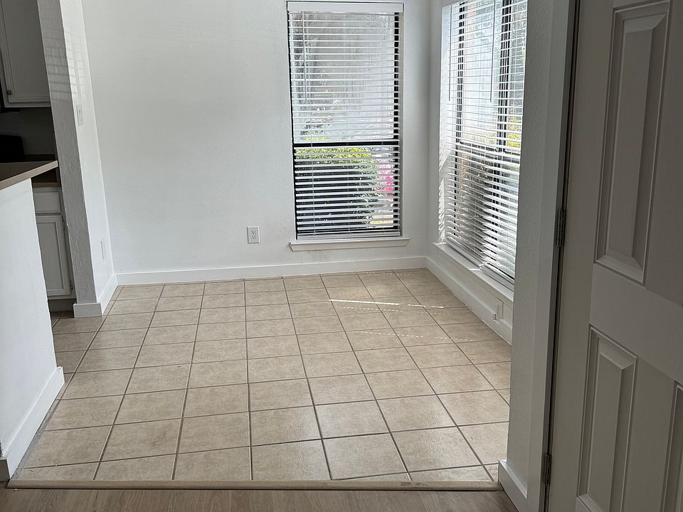 Large Dining area adjoining the kitchen. Ceiling fans in all living spaces