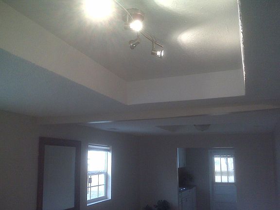 tray ceiling in liv room with track lighting