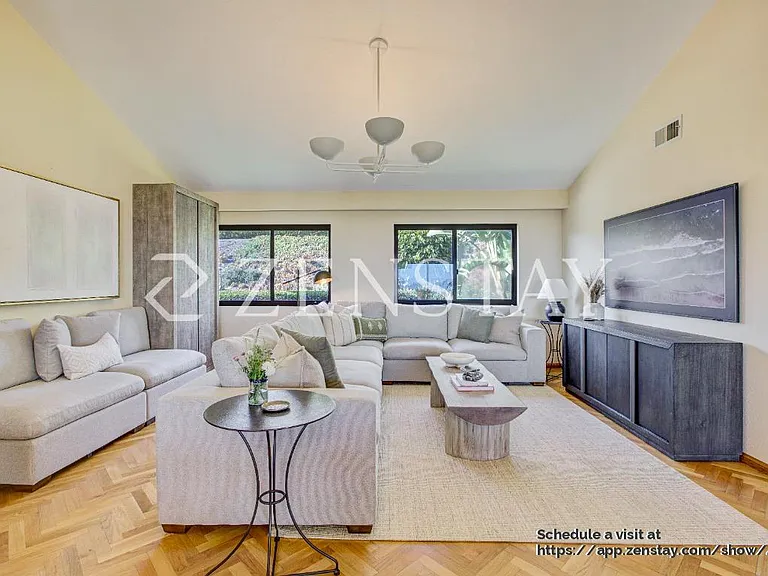 Sun-filled living area designed for comfort, gathering, and easy entertaining