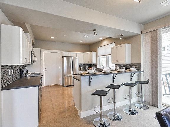 Spacious kitchen with bar