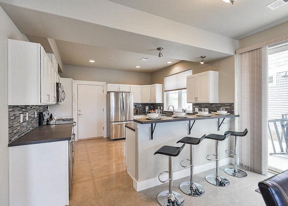 Spacious kitchen with bar
