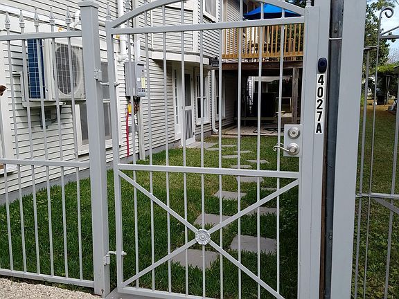 Small gated yard and covered deck