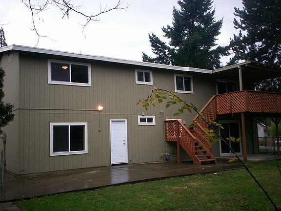 Back Deck and Covered Lower Patio Opening to Fenced Backyard