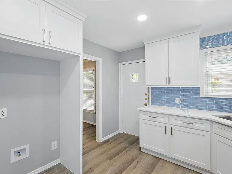 Recently updated kitchen featuring quartz countertops, white cabinets, new spacious pantry and dedicated utility closet. Washer and dryer included.