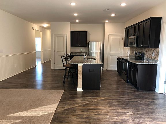 kitchen with granite island and counters. Extra large cabinets
