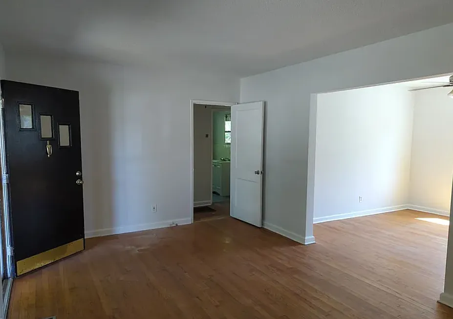 Living room into dining room - 100 Rees Ave
