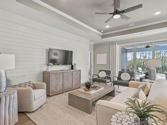 Unwind in the expansive Gathering room, where comfort meets sophistication in a welcoming space desi