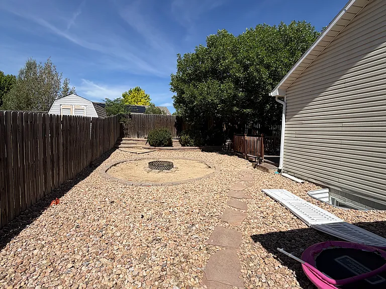Side of the house. Fire pit area