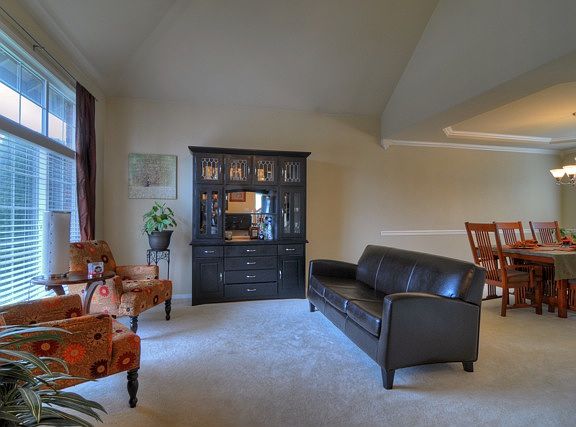 Formal living room with vaulted ceilings for a feeling of opulent spaciousness.