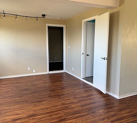 Doors to bedroom and bathroom from living room