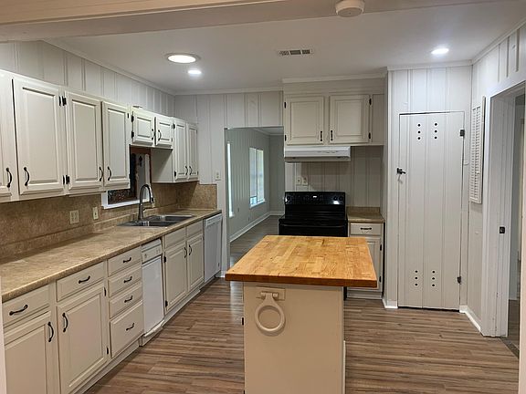 Large Kitchen with Updated Storage Options and Cutting Board Island