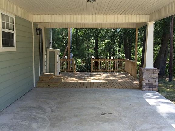 Carport with connecting deck