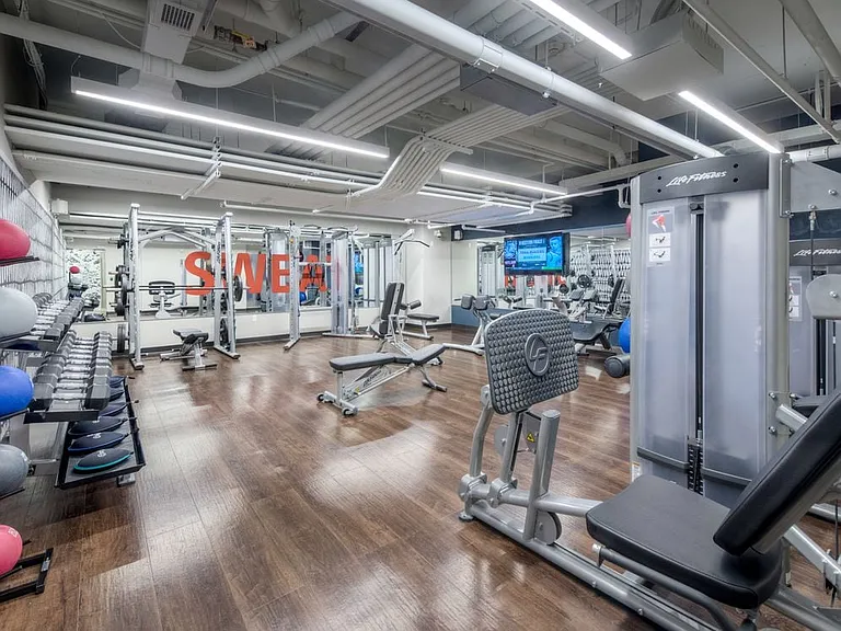 Fitness center with strength equipment and flat screen television