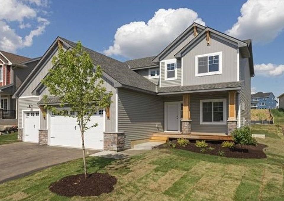 Custom designed front elevation by award winning builder.  Custom corbels and columns with Andersen windows and much more!