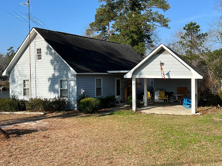 Back of house with carport/patio
