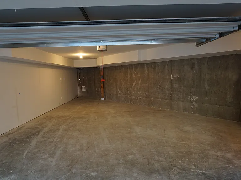 two car garage with double additional covered car port .