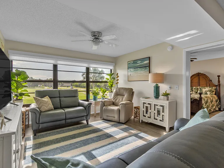 Living area with lake and golf course views