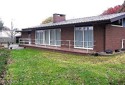 Rear View of the home with its extensive plate glass windows.