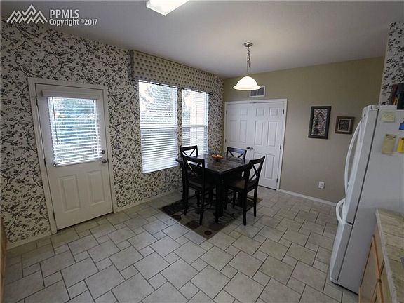 Eat-in kitchen with pantry and laundry area.