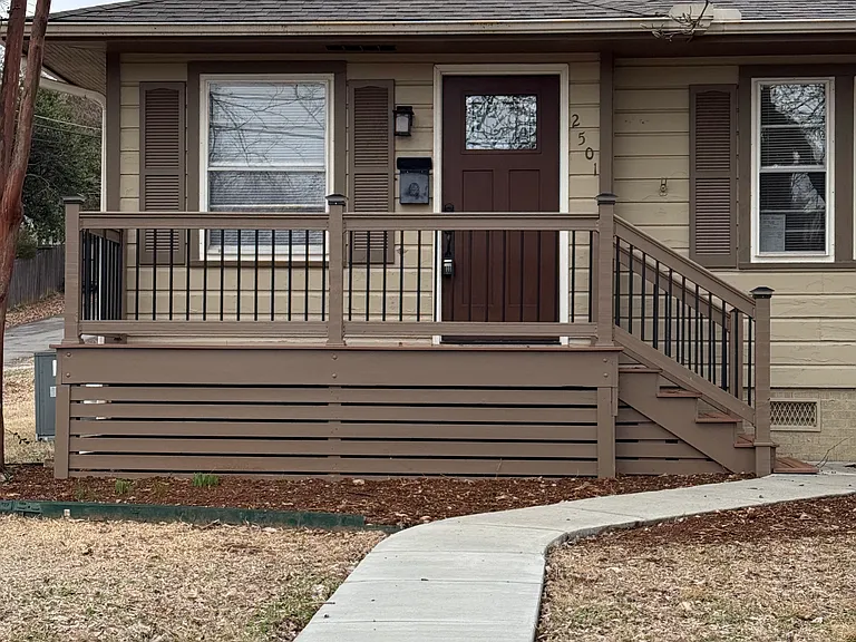 Two chairs on this new porch and you are set for the sunset show! Decking is easy care Trex!