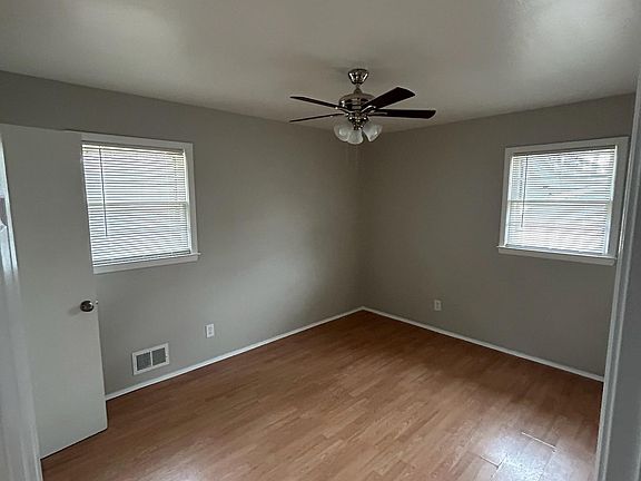Master bedroom - freshly painted and new ceiling fan with adjoining 1/2 bath.