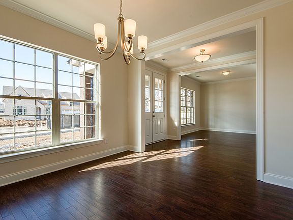 Nickle finish chandelier, hardwood floors