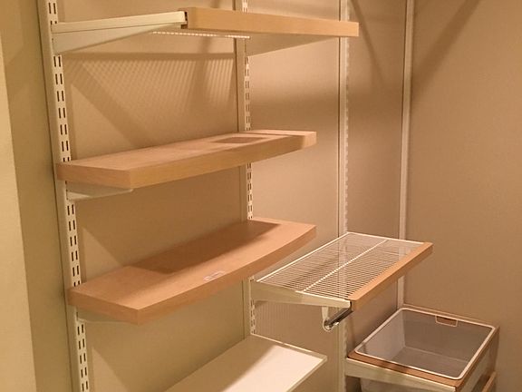 Master bedroom closet with elfa shelving