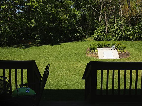 Back yard with storm shelter