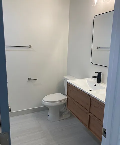 Shared bathroom with updated vanity and modern finishes