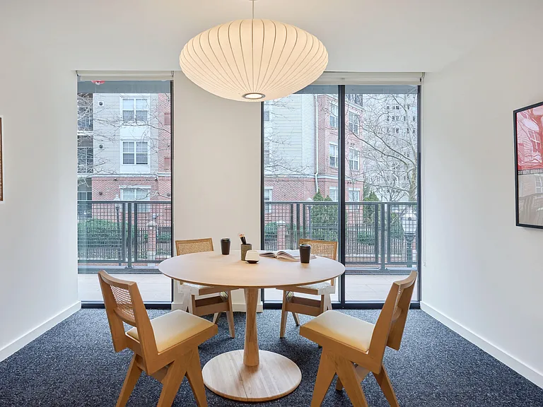 Community co-working area with private meeting rooms and offices