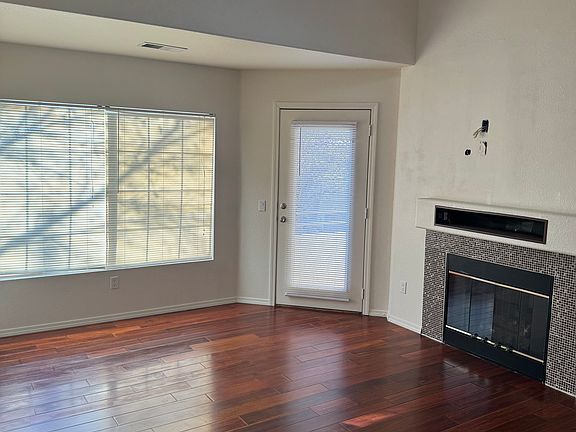 Living room with a door to the balcony.