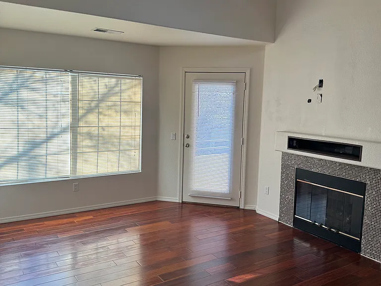 Living room with a door to the balcony.