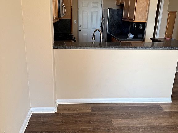 View from first floor patio door showing dining area and kitchen