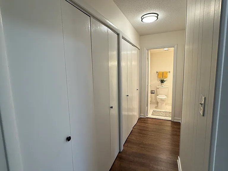 Hallway with large closets