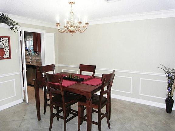 FORMAL DINING W/ CROWN MOLDING AND CHAIR RAILING