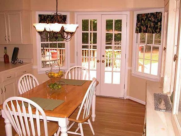 Breakfast Area has french doors leading to large deck and lovely backyard.