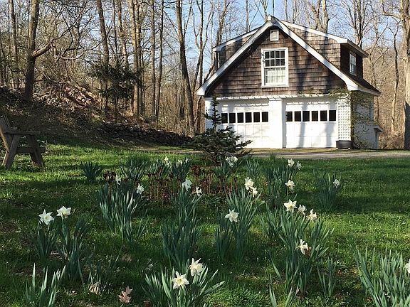 2 car garage across the street. Left bay is for your car. Also, a spot for you to park next to the house.
