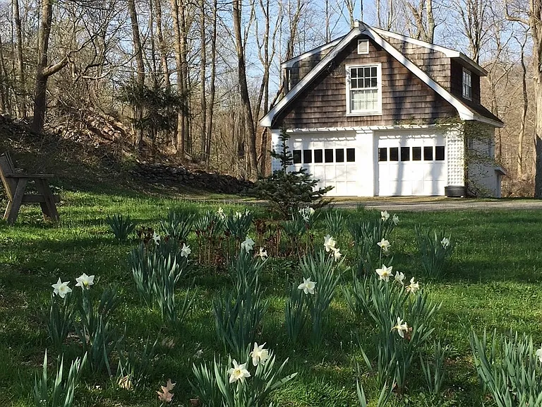 Large 2 car garage across the street. Left bay is for your car. Also, a spot for you to park next to the house.