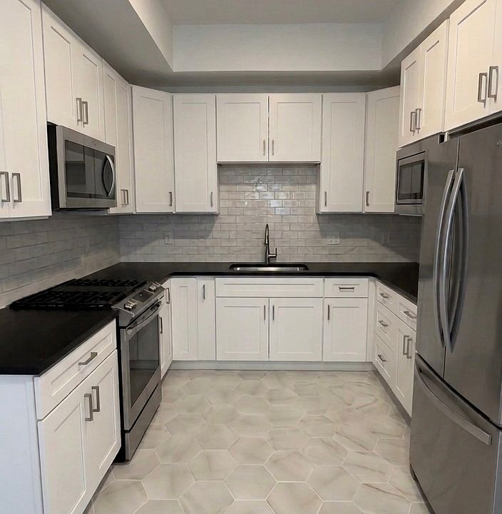 Kitchen- This room has been virtually staged using AI to help visualize its layout and design potential.