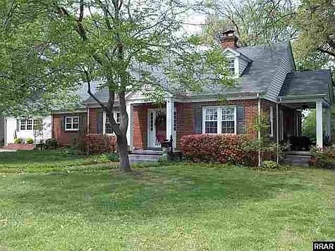 4 or 5 bedr., brick with wood floors, 2 gas fp, super kitchen with appl.- in town but country feel!