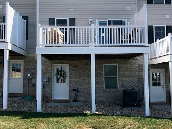 Back of home with walk out basement