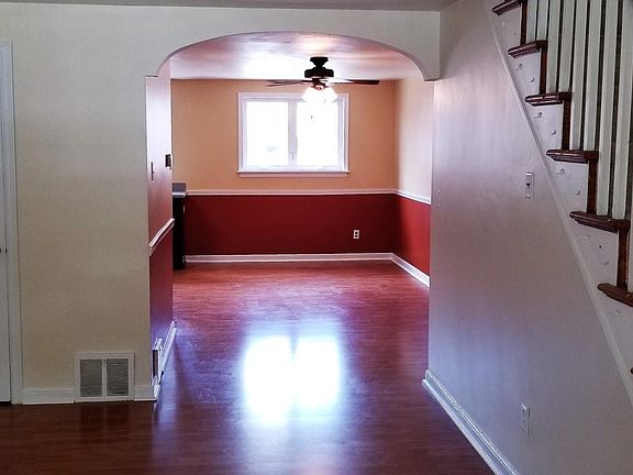 View through Living room to Dining room. (Old photo, colors have been painted)
