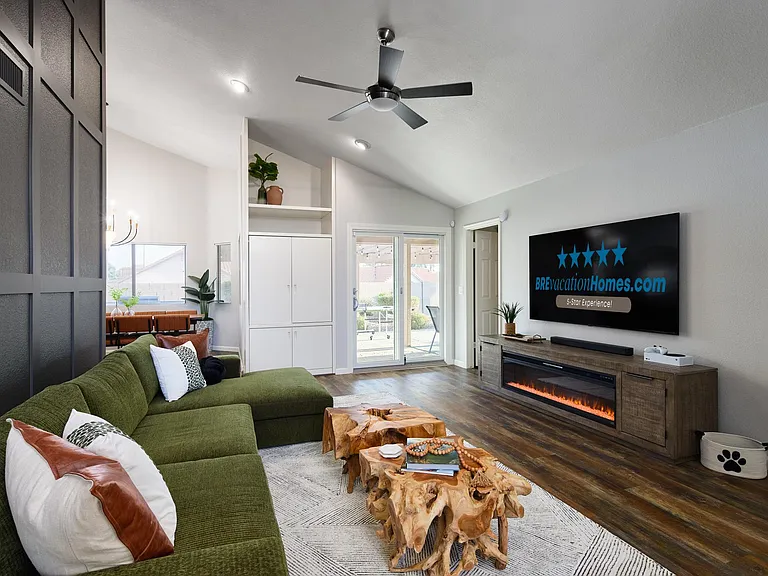Opens to Back Patio. Smart TV, couch and tables replaced w/sectional