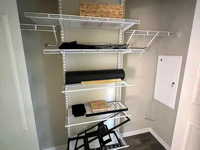 Hallway Closet Storage across from the furnace and hot-water tank