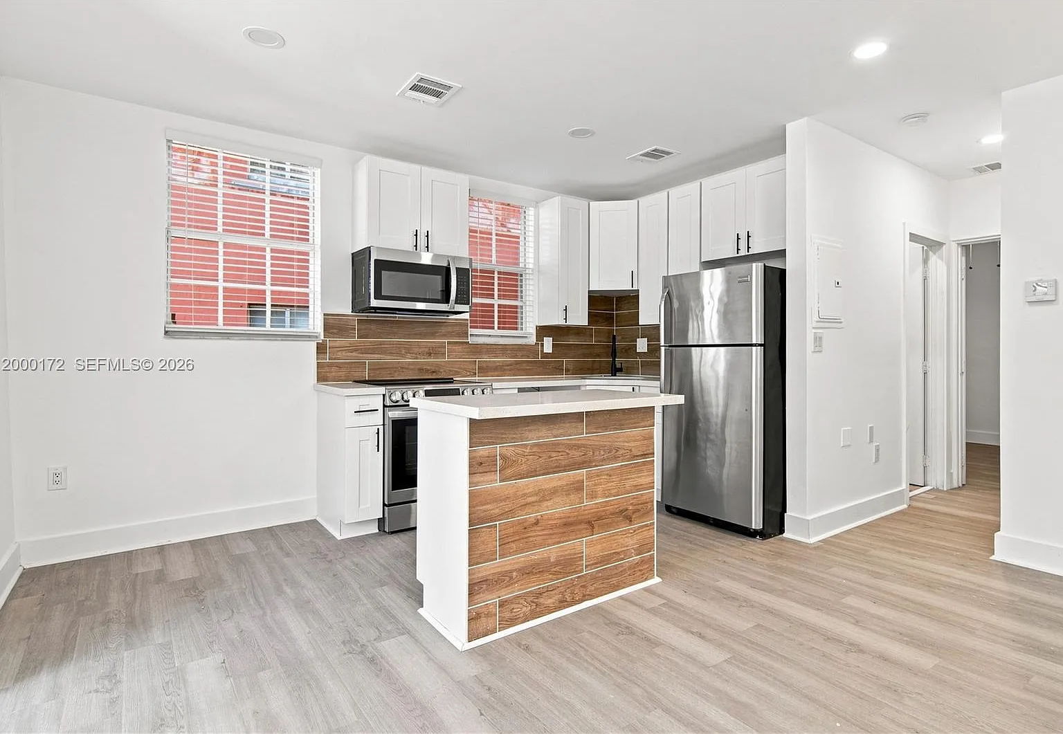 Midtown Condominium On 62 — Photo 1