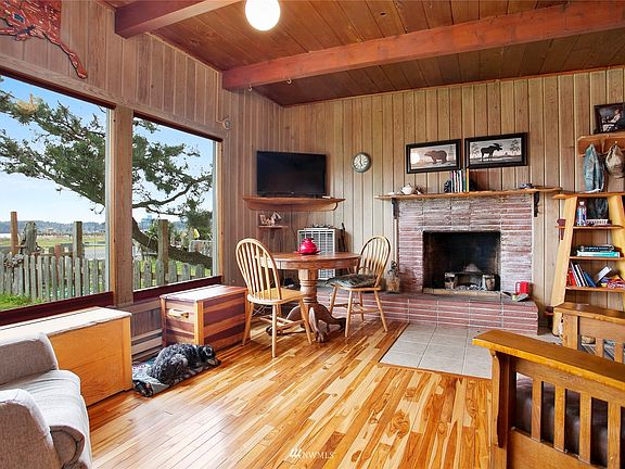 Brick wood burning fireplace, hardwood floors.
