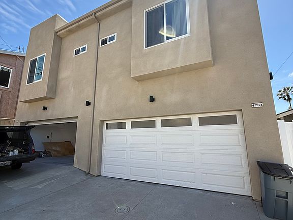 Alley view with two car garage